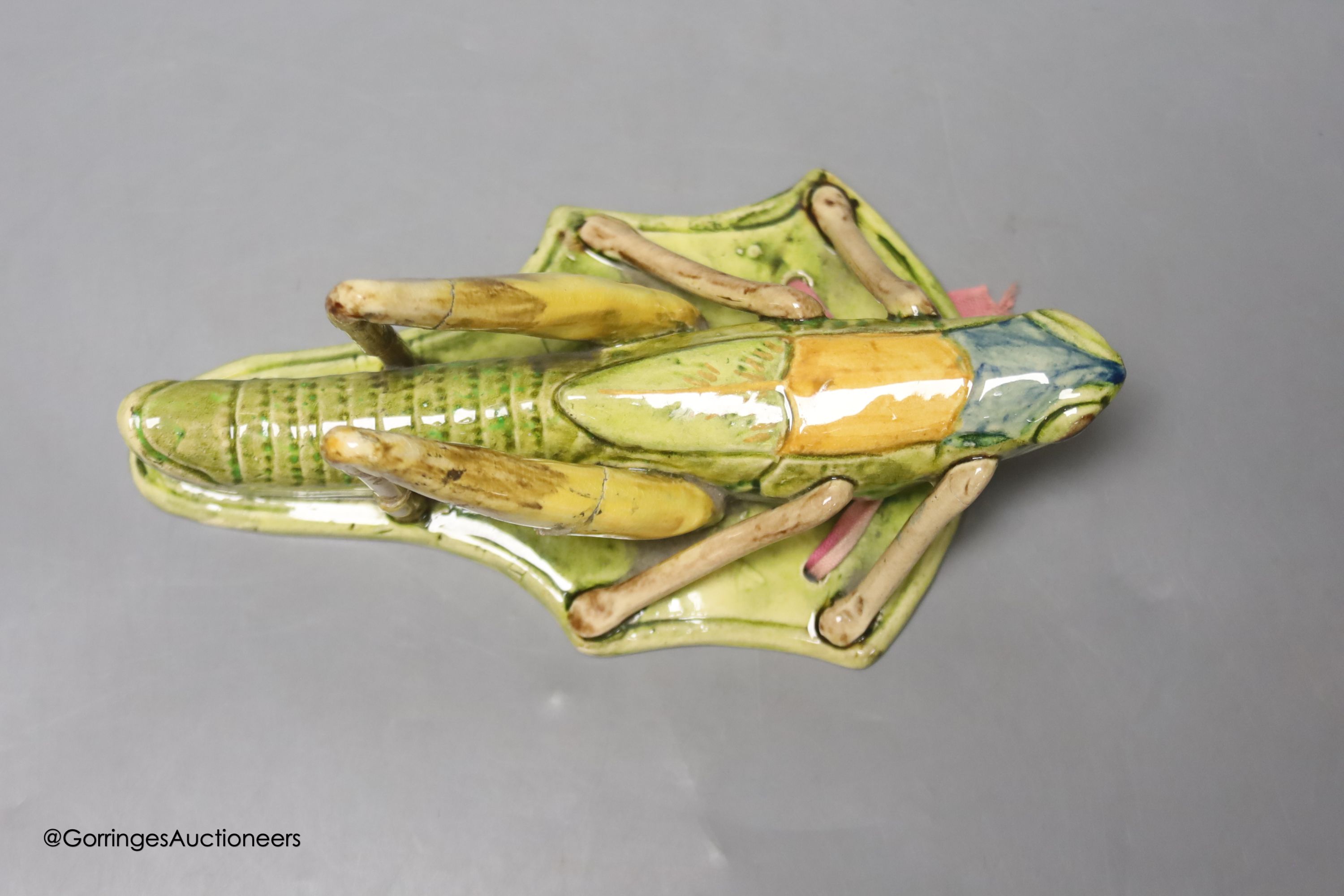 A Continental pottery 'grasshopper' wall pocket, early 20th century, possibly Caldas da Rainha, length 19cm